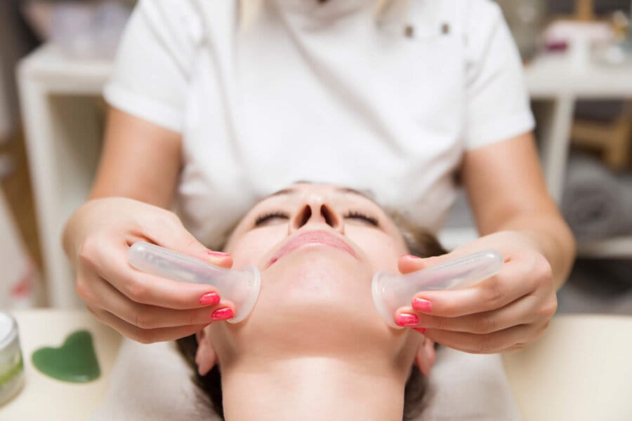Lymphatic Drainage esthetician performing results-driven facial treatment in Fullerton for healthy glowing skin