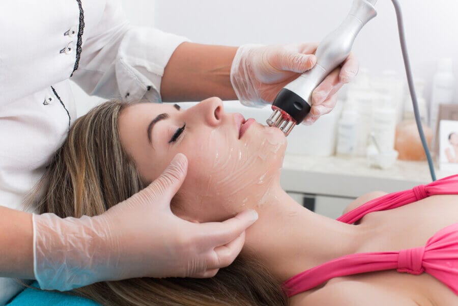 esthetician performing results-driven facial treatment in Fullerton for healthy glowing skin
