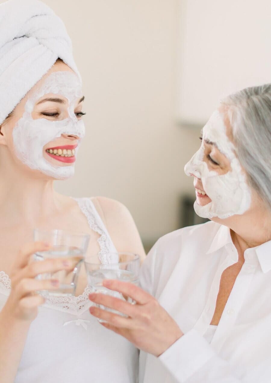 facial-fullerton-mothers-day women enjoying facial treatment together in Fullerton spa for glowing skin and relaxation