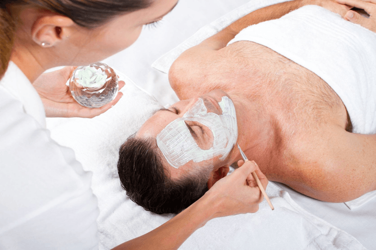 Male client receiving a relaxing express facial treatment at Personalized Skin Care in Fullerton