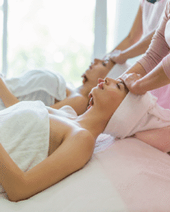 two women enjoying facial treatment together in Fullerton spa for glowing skin and relaxation